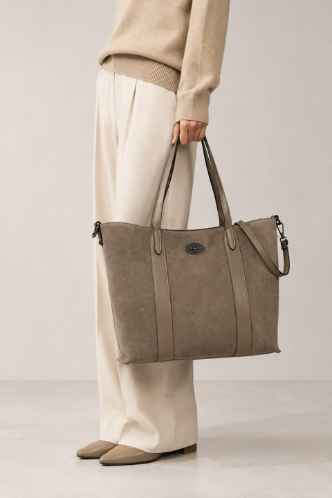 Leather tote and shopping bag carried by a model