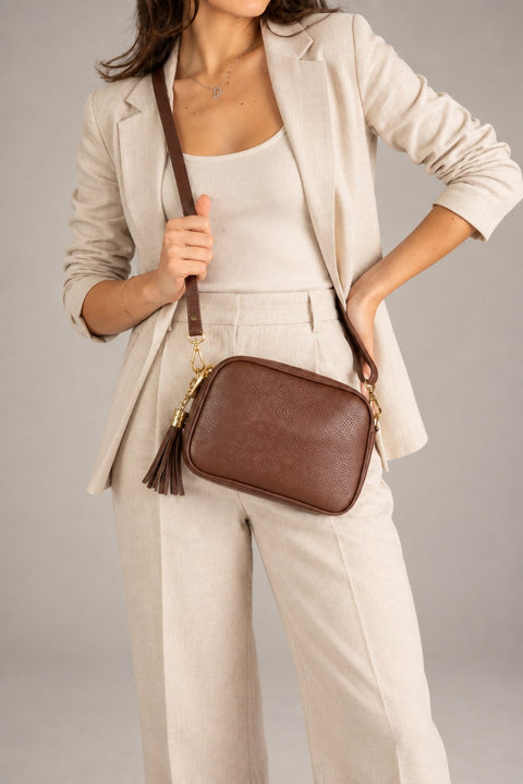 Leather crossbody bag worn by a model