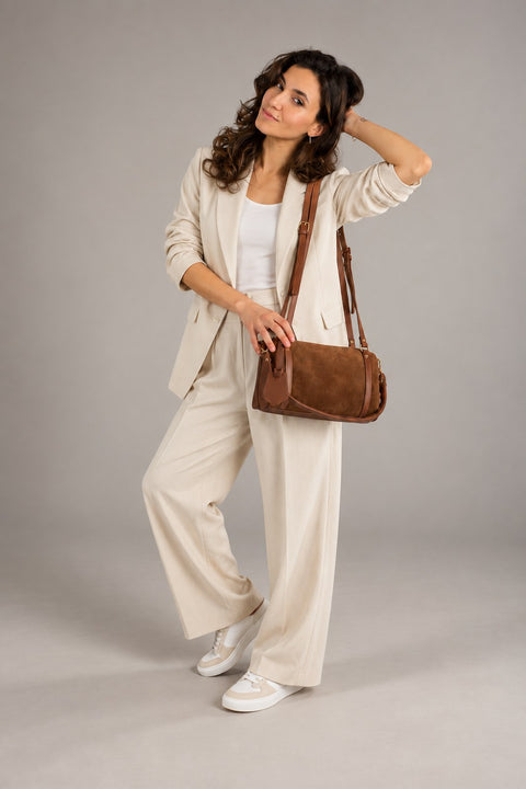 Leather bowling bag worn by a model